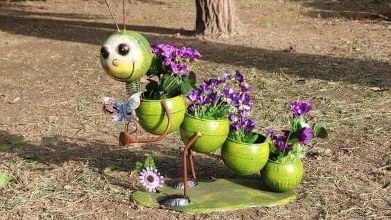 Caterpillar made from recycled pots etc